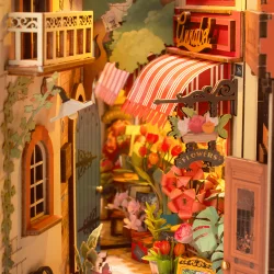 Bogreol miniaturehus byggest i tr med LED lys, Floral Corner