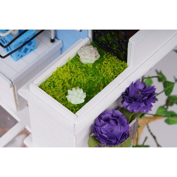 Miniaturehus byggest i tr med LED lys, Dora's Loft